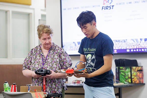 Ann McClung, STEM coordinator in ECU's College of Education, leads a demonstration on robotics during the symposium. (Photo by Steven Mantilla)