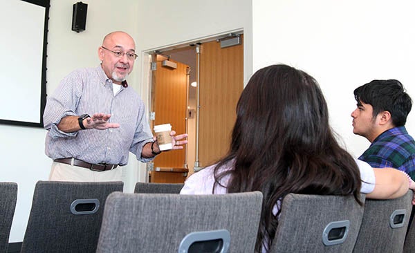 Pablo Hernández, the director of project management services at 35 North in Durham and an East Carolina University alumnus, talks with students in the Main Campus Student Center.